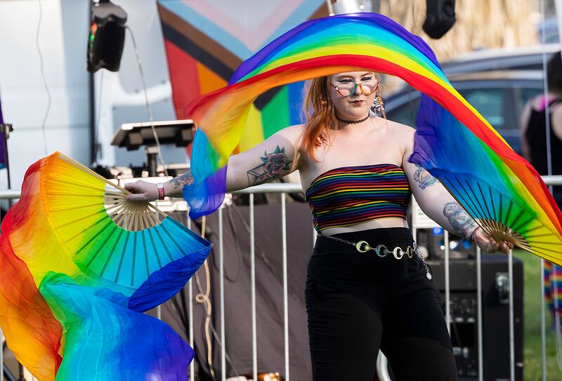 Sydney Brown dances with colorful fans Saturday, June 14, 2025, during Sauk Valley Pride Fest in Dixon.