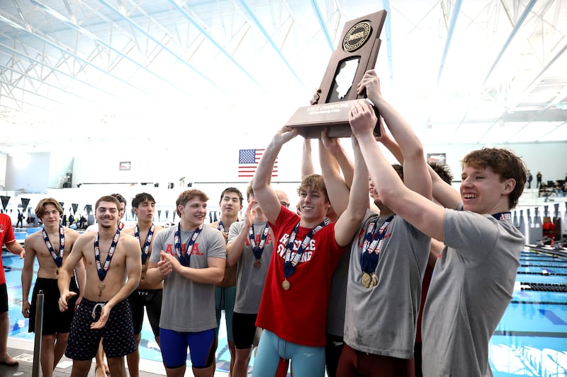 Hinsdale Central swimmers celebrate their first-place finish in the IHSA Boys State Championships on Saturday, March 1, 2025 at the FMC Natatorium in Westmont.