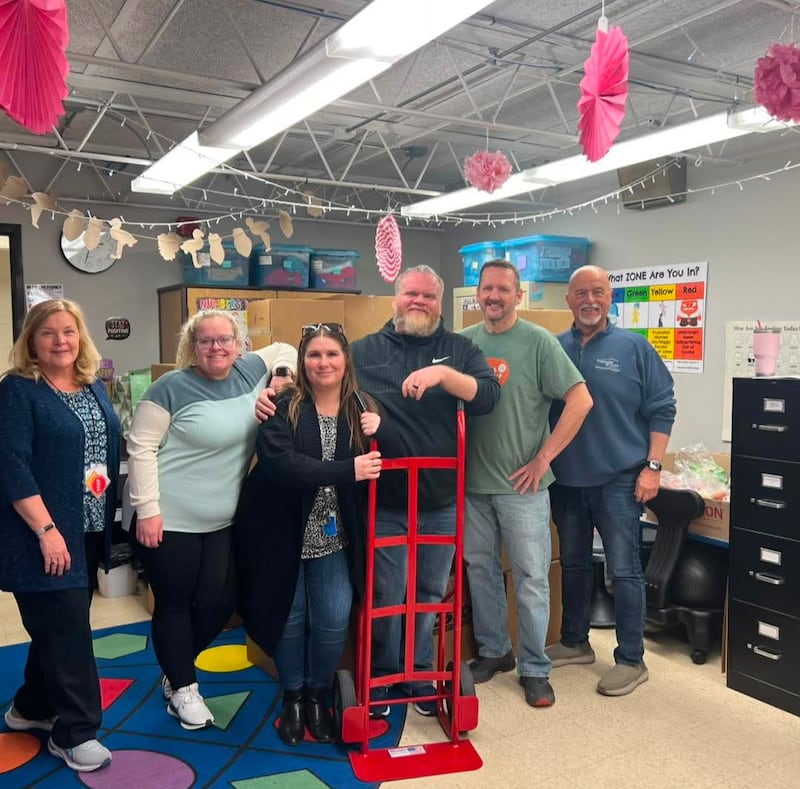 A team from the Let's Ketchup nonprofit organization drops off donations of food, clothing and hygiene items for a Cares Closet in Bourbonnais Elementary School District.