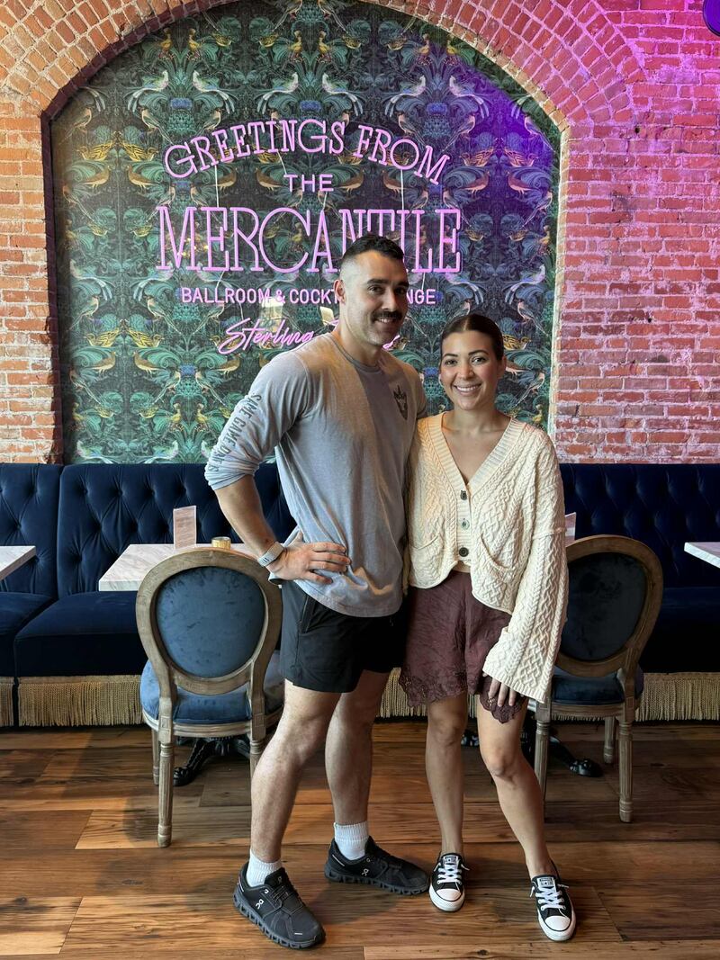 Ryan and Ashley Nares, owners of The Mercantile, stand in front of the archway that will soon open into the restaurant’s expanded dining area, which will add more seating along with darts and other entertainment options.