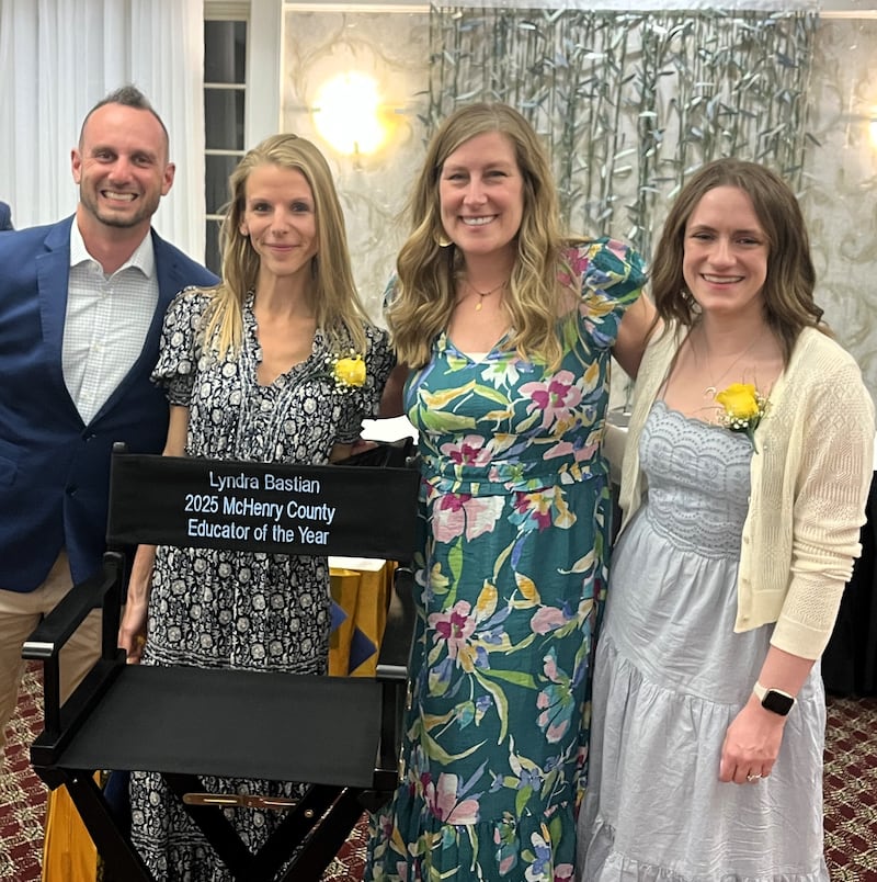 Lyndra Bastian, second from left, orchestra director at Creekside Middle School and Woodstock High School, was named Educator of the Year by the McHenry County Regional Office of Education. With her from left are Creekside Middle School Principal Ryan Doyle; Creekside math teacher Shanon Laidig, last year's overall winner; and Creekside English teacher Morgan Pigott.