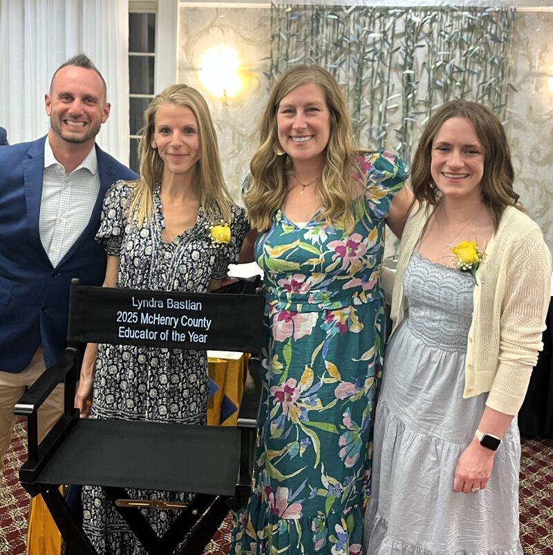 Lyndra Bastian, second from left, orchestra director at Creekside Middle School and Woodstock High School, was named Educator of the Year by the McHenry County Regional Office of Education. With her from left are Creekside Middle School Principal Ryan Doyle; Creekside math teacher Shanon Laidig, last year's overall winner; and Creekside English teacher Morgan Pigott.