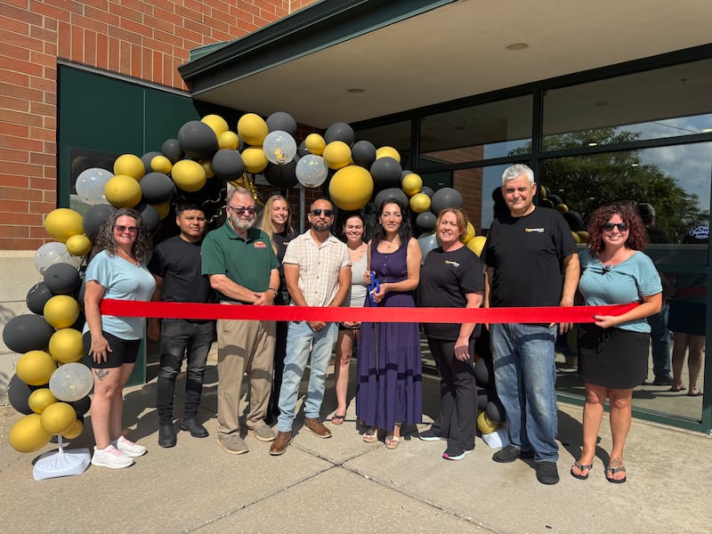 Eggventure Cafe Owner Sevcan Ustura cuts the ribbon for the restaurant’s grand opening surrounded by her family, Mayor Ric Offerman, the Grundy County Chamber team and its Ambassadors.