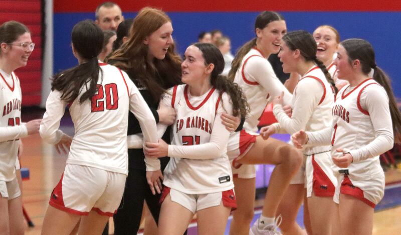 Huntley’s Red Raiders get revved up after a win over Hononegah in girls basketball at Dundee-Crown High School in Carpentersville on Tuesday, November 25, 2025.