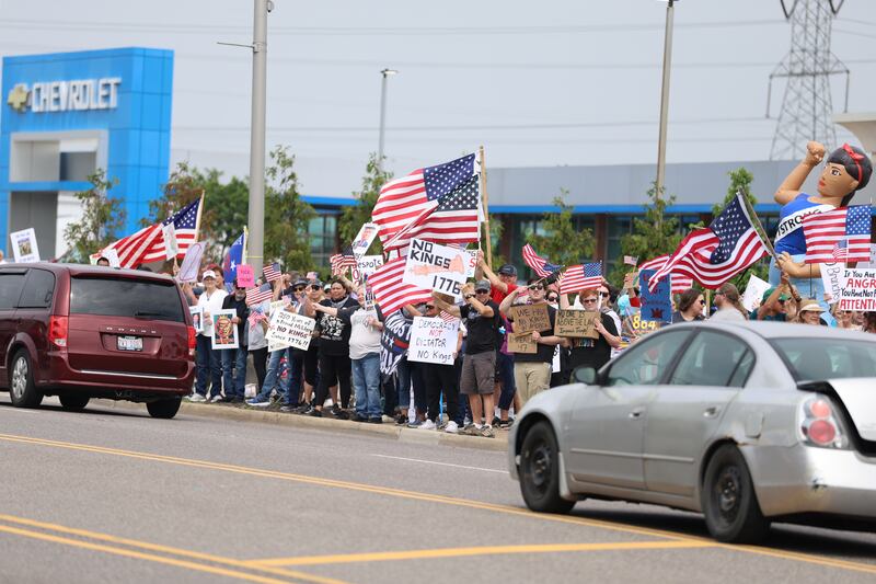 Hundreds of people gathered at the intersection of Larkin Avenue and West Jefferson Street in Joliet as part of the nationwide No Kings Day protests on Saturday, June 14, 2025. Organizers estimated 600 people attended the Joliet event.