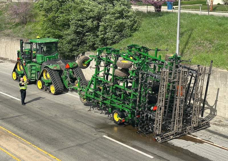 Peru Police work the scene of a tractor and tandem disk that leaked hydraulic fluid on the shoulder of Illinois Route 251 and 7th Street overpass on Monday, April 28, 2025. Peru Fire, Illinois Department of Transportation and Peru police responded to the incident.