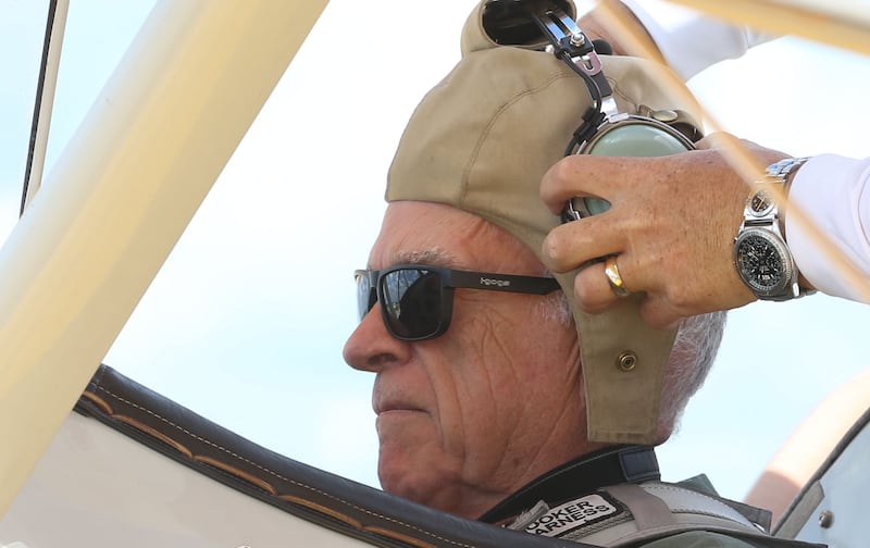 Veteran Lowell Beenenga of Tonica, puts on his helmet and headset before taking off in a 1942 Boeing Stearman A-75 Primary Trainer during a Veteran Dream Flight on Tuesday, Sept 2, 2025 at the Illinois Valley Regional Airport in Peru.