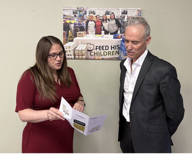 Feed His Children Director of Operations Samantha Laury shares her organization’s “Hope Starts Here” publication with Starved Rock Country Community Foundation President Fran Brolley. Feed His Children received a $1,500 SRCCF community grant to help fund its grocery bag program for impoverished families.