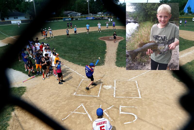 Kids play Wiffle ball at the McHenry VFW Monday, June 30, 2025, at a celebration of the life of Alan Kroll, 11, inset, who died in a car crash on June 23 near Marengo.