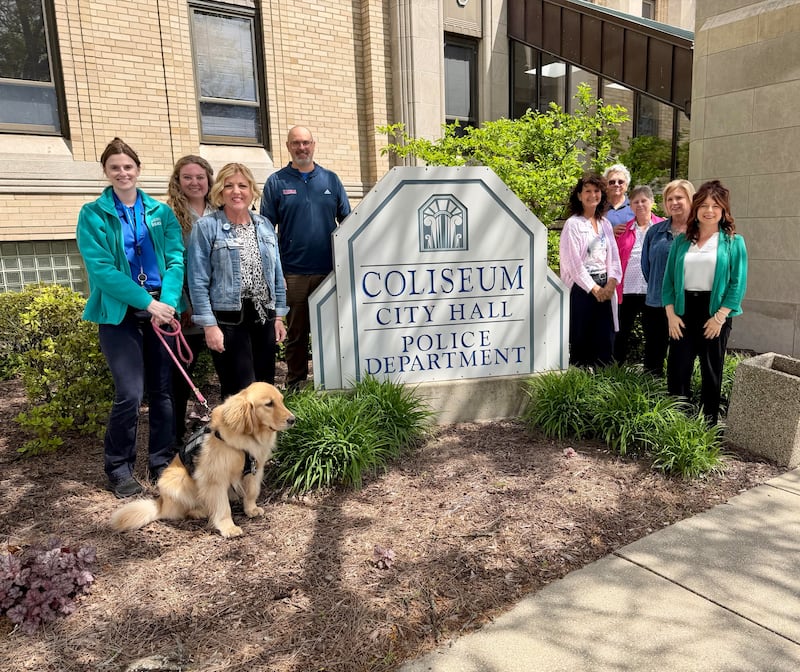 Members of the Dementia Friendly Sterling Action Team (DFSAT) include Mary Toth with Millie of the Sterling Police Department (from left); Beth Sterk, CGH Health Foundation; Dallas Knack, Sauk Valley Area Chamber of Commerce; Scott Schumard, city of Sterling; Jennifer Snow, NIAAA; Bob and Jan W.; Teri Shaw, Whiteside County Senior Center; and Sami Wiggins, Castor Home Health Solutions.