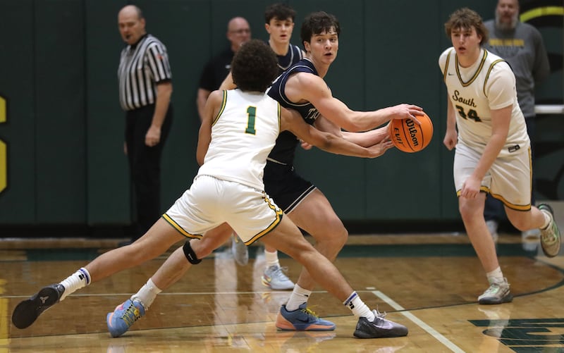 Crystal Lake South's Noah Cook fouls Cary-Grove's Adam Bauer during a Fox Valley Conference boys basketball game on Friday, Jan. 23, 2026, at Crystal Lake South High School.