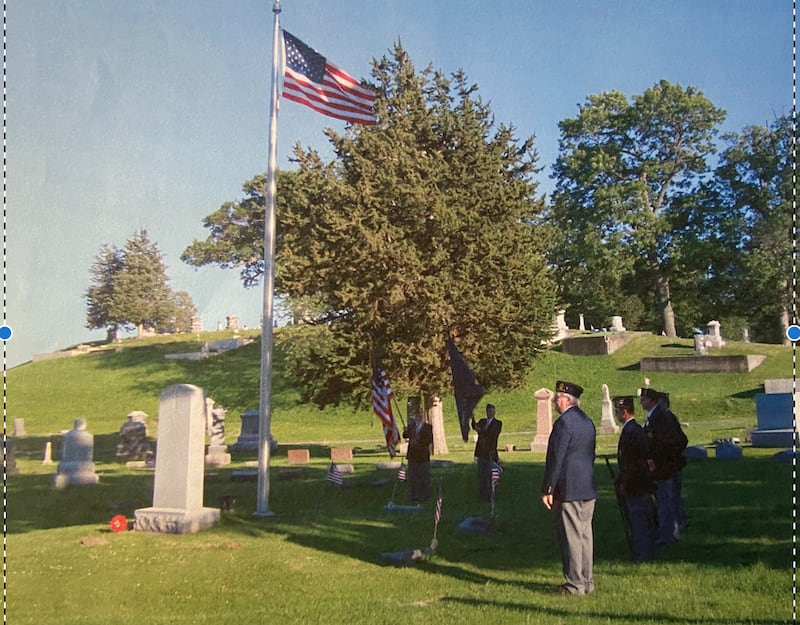 Veterans salute at the American Legion Post 402 Veteran Memorial Circle in Fulton Township Cemetery in Fulton.
