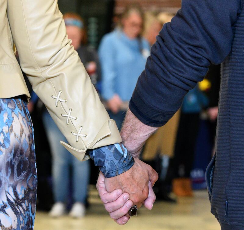 Hands are clasped during CASA Kane County's annual Hands Around the Courthouse and County event Thursday at the Kane County Courthouse in Geneva. CASA (Court Appointed Special Advocates) Kane County is a nonprofit agency training volunteers to advocate on behalf of children in foster care due to abuse and neglect.