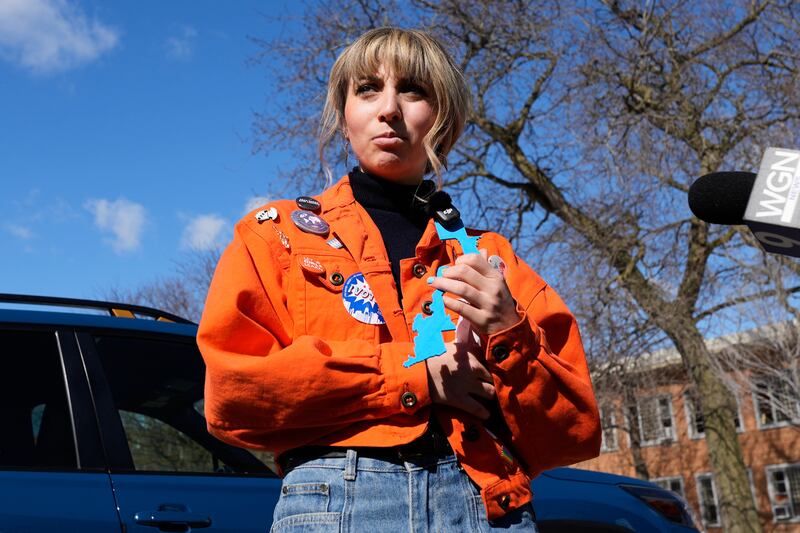 FILE - Democratic candidate for Congress Kat Abughazaleh talks with reporters after voting in the primary election for the upcoming midterms outside the Chicago Park District Loyola field house in Chicago, March 17, 2026. (AP Photo/Nam Y. Huh, File)