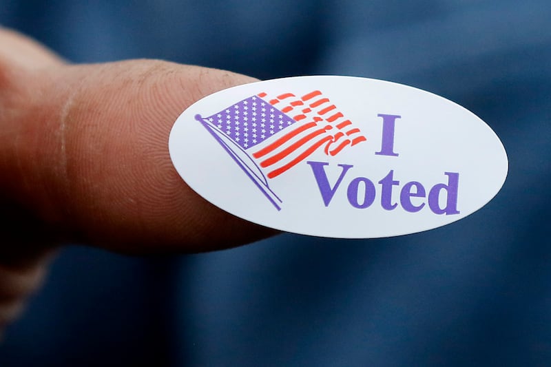 A voter shows off his “I Voted” sticker on Monday, Nov. 4, 2024, after voting at the Algonquin Township Office at 3702 US Hwy 14, in Crystal Lake.