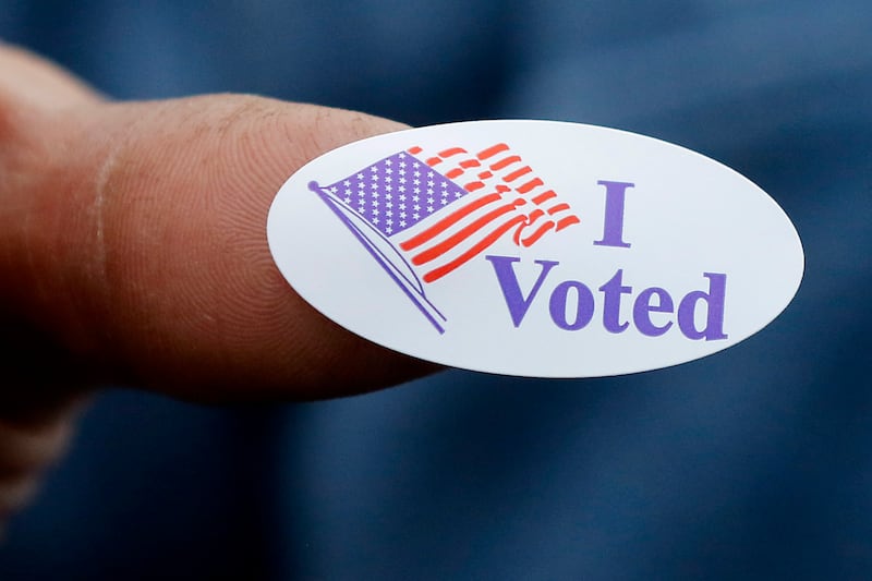 A voter shows off his “I Voted” sticker on Monday, Nov. 4, 2024, after voting at the Algonquin Township Office at 3702 US Hwy 14, in Crystal Lake.