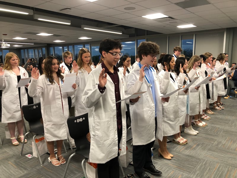 Seniors who completed McHenry High School District 156's four-year biomedical science program recite the Hippocratic Oath on Wednesday, April 30, 2025, as part of the white coat ceremony. of the 31 students, 24 also completed the CNA program.