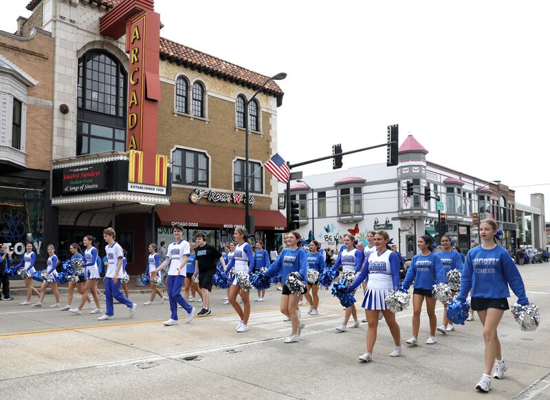 St. Charles North cheerleaders walk on Route 64 on Friday, Sept. 27, 2024 during the school’s annual homecoming parade in St. Charles.