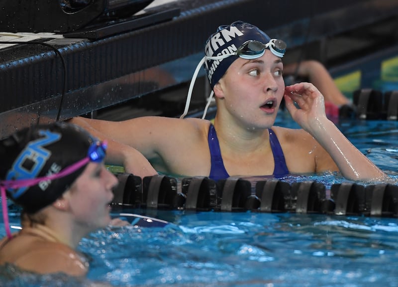 Dundee-Crown’s Rachel Johnson views her time of 54.61 after finishing third in the 100-yard backstroke during the girls state swimming and diving finals at the FMC Natatorium on Saturday, Nov. 15, 2025 in Westmont.