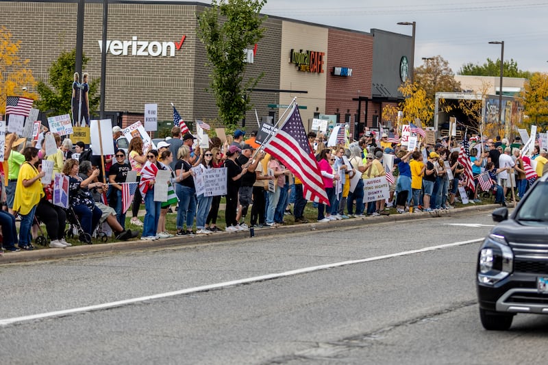 Protestors line Plainfield Road in Joliet during the No Kings Protest in Joliet on Oct. 18, 2025.