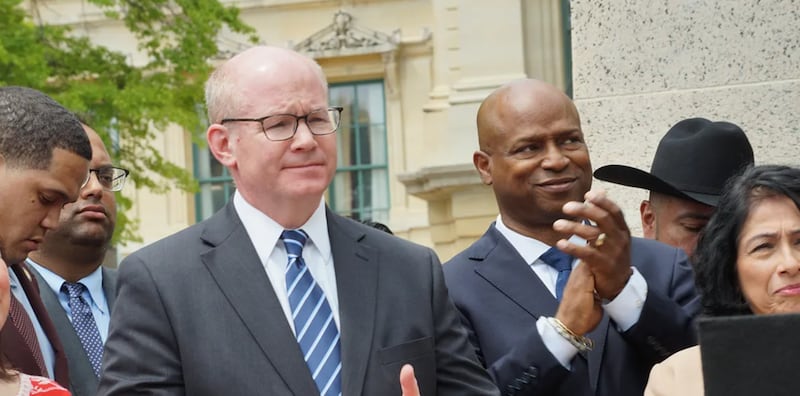 Senate President Don Harmon, left, and House Speaker Emanuel “Chris” Welch are named as defendants in a lawsuit challenging passage of a bill that would make a significant change in state law regarding corporate liability.