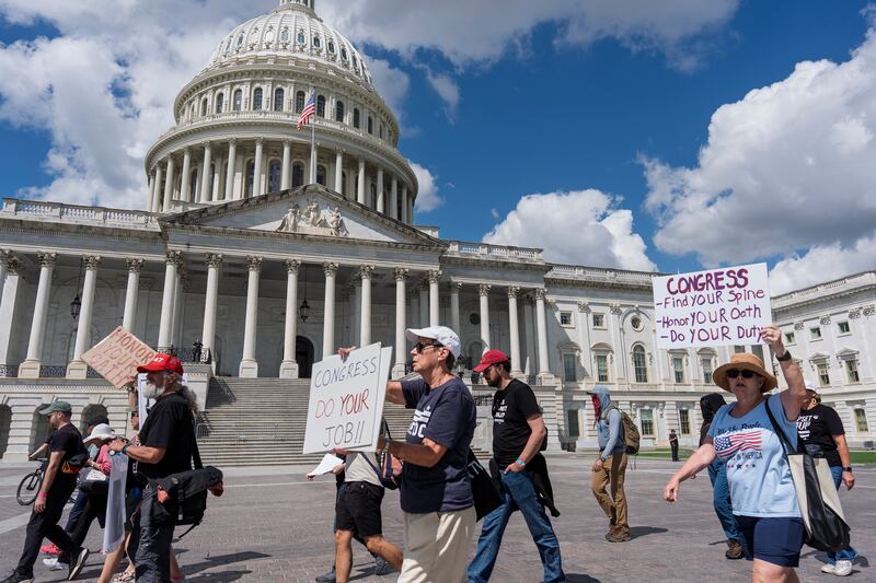 Demonstrators protest the policies of President Donald Trump, the Congress, and the delay in the Epstein investigation as lawmakers return from the August recess, at the Capitol in Washington, Tuesday, Sept. 2, 2025. (AP Photo/J. Scott Applewhite)