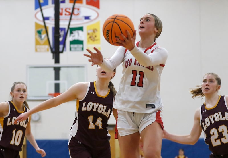 Huntley's Anna Campanelli drives to the basket during the IHSA Class 4A Gurnee Warren Supersectional girls basketball game against Loyola Academy on Monday, March 3, 2025, at Warren Township High School in Gurnee.
