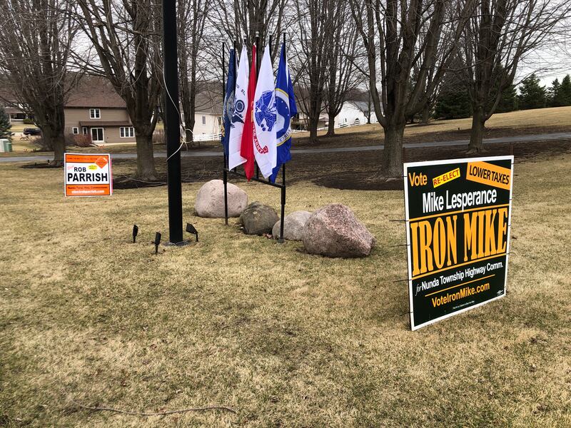 Signs for both Nunda Township Highway Commissioner campaigns in a McHenry yard on Tuesday, March 18, 2025.