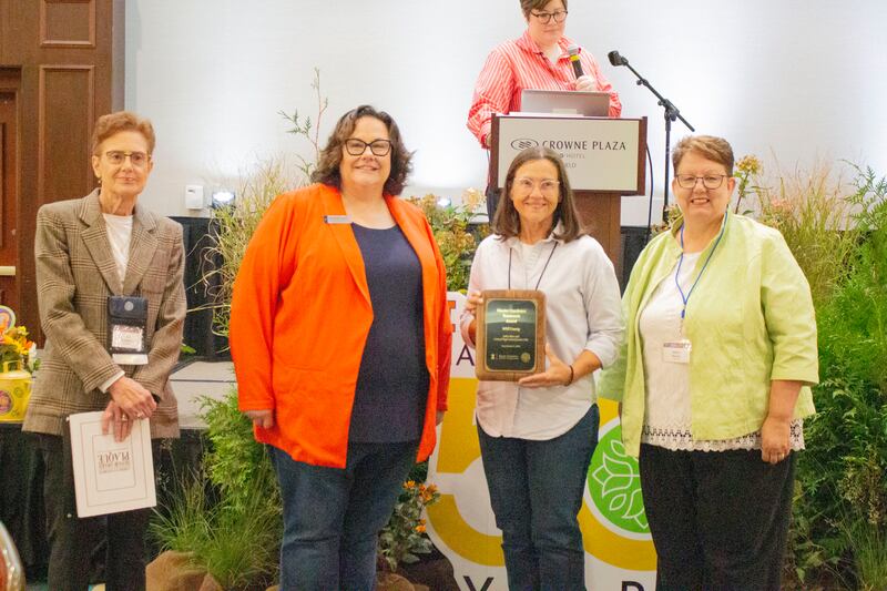 Amy Stewart of Joliet (left) and Sue Gregory of Shorewood (third from left) received the 2025 Teamwork Award from Amanda Taylor, director of Workforce Development, and Janice McCoy, associate director of the University of Illinois Extension, at the 50th anniversary Master Gardener Conference  in Springfield on Sept. 4-5, 2025.
