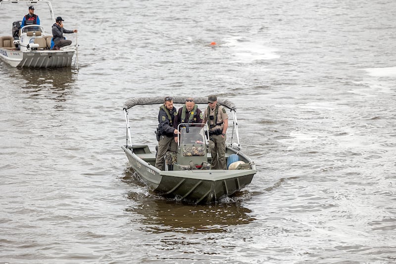 Search squads check the Rock River in Dixon Tuesday, April 14, 2026, after an individual jumped over the railing off of the Peoria Avenue Bridge late Monday night.