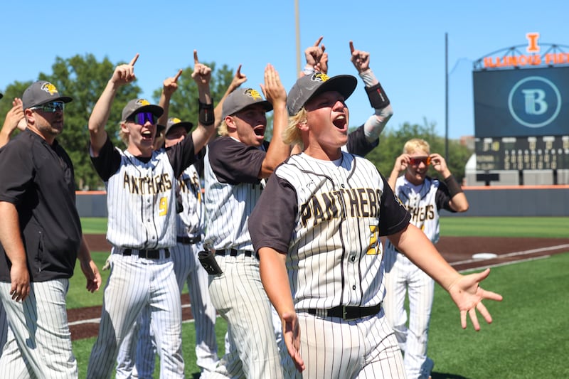 Putnam County's Traxton Mattingly celebrates with teammates as they turn toward their cheering fan section following their 4-3 victory in eight innings over North Clay in the IHSA Class 1A State semifinals on Friday, June 12, 2026, at the University of Illinois in Champaign.