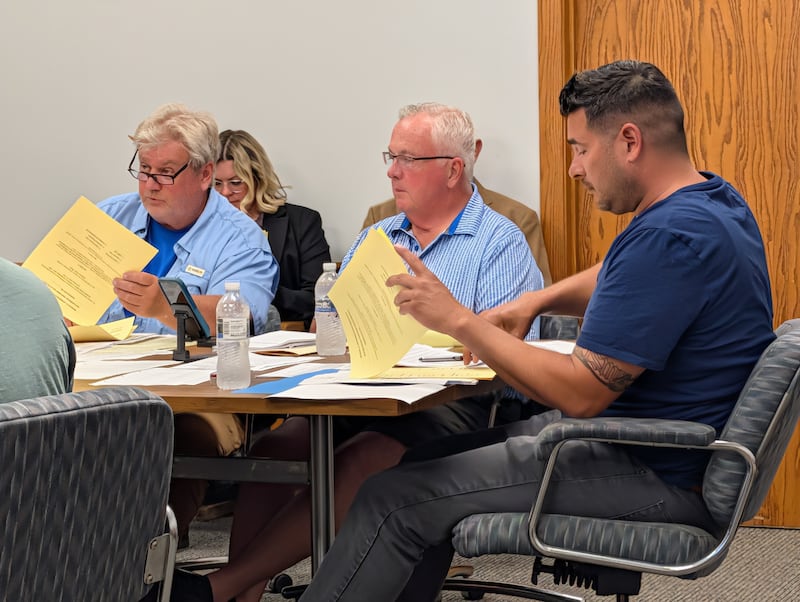 Bourbonnais Township Supervisor Jeff Umphrey, Bourbonnais Township Clerk Brian Rogers and Bourbonnais Township Highway Commissioner during the board's May meeting.
