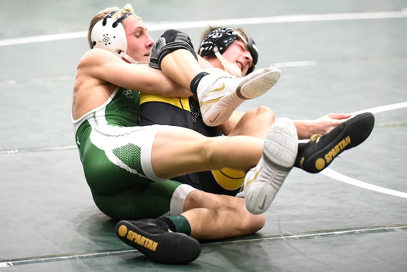 Coal City's Luke Munsterman, left, controls Reed-Custer's Rylan West during the Illinois Central Eight Conference 138-pound championship match at Coal City Saturday, Jan. 24, 2026.