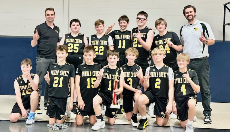 The Putnam County seventh-grade boys basketball team won the Academy of Saint Carlo Acutis tournament champions by defeating by defeating Spring Valley JFK (34-16), Marquette (55-21) and Mendota Northbrook in the championship (30-14). Team members are (front row, from left to right) Jacob Borri, Wyatt Rue, Liam Judd, Hans Frund, Mylo Mertel, Liam Askeland and Sean King; and (back row) assistant coach Mike Borri, Denny Long, Jace Newsome, Hudson Heiberger, Marshall Holocker, Mason King and coach TJ Askeland.