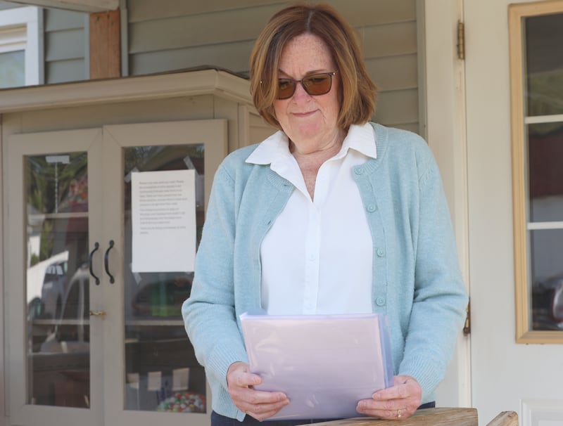 Karen Hall looks through her notes before a meeting at A Servant's Heart on Tuesday, May 12, 2026 in Ottawa.