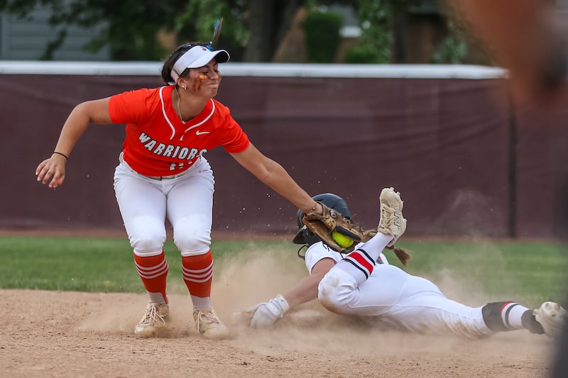 Lincoln-Way West's Reese Rourke (21) applies the tag on Lincoln-Way Central's Mia Degliomini (8) at second base during Class 4A Lockport sectional softball game between Lincoln-Way Central at Lincoln-Way West on Tuesday, June 3, 2025 in Lockport.