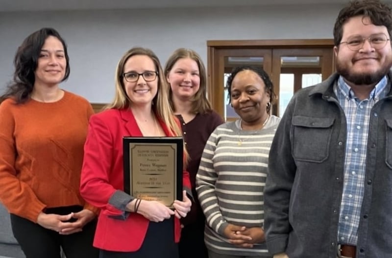 Kane County Auditor Penny Wegman with her 2025 Auditor of the Year Award stands with her staff: Dalia Samak (left), Wegman, Emma Saveley, Crystal Head and Porfirio Lara. Illinois Association of County Auditors presented the award during a Finance Committee meeting Tuesday, Dec. 23, 2025.