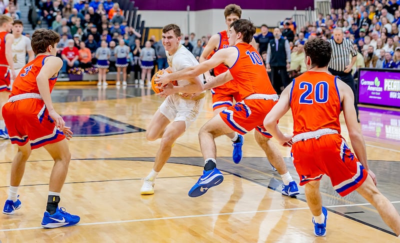 Pecatonica senior Cooper Hoffman drives into the paint during the first half of action of the sectional final on Friday, March 7, 2025 at Pecatonica High School.