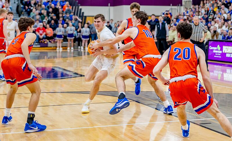 Pecatonica senior Cooper Hoffman drives into the paint during the first half of action of the sectional final on Friday, March 7, 2025 at Pecatonica High School.