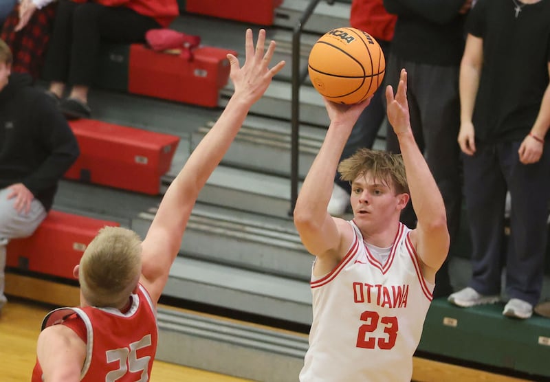 Ottawa's Owen Sanders (23) shoots a jump shot over Streator's Joe Hoekstra (25) during the Class 3A La Salle-Peru Regional semifinals Wednesday, Feb. 25, 2026, in Sellett Gym in La Salle.
