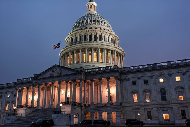 The Capitol is seen at dusk as Democrats and Republicans in Congress are angrily blaming each other and refusing to budge from their positions on funding the government, in Washington, Tuesday, Sept. 30, 2025. (AP Photo/J. Scott Applewhite)