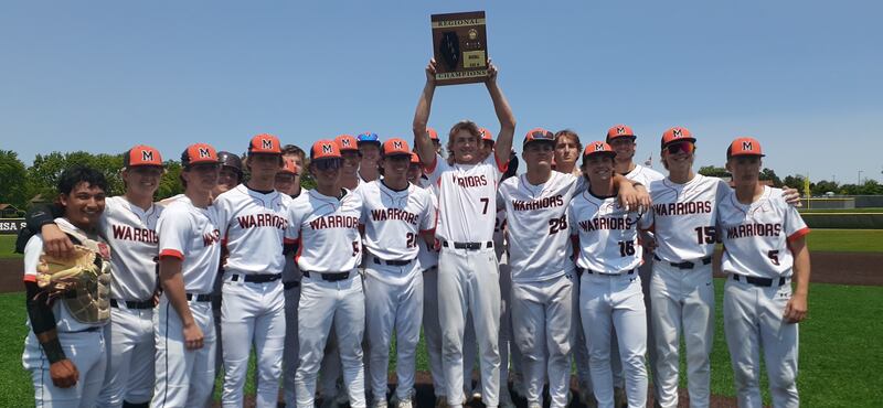 McHenry pitcher Brandon Shannon holds up the regional plaque after beating Jacobs 2-1 to win the Class 4A McHenry Regional title.