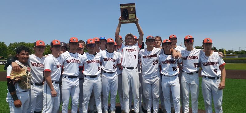McHenry pitcher Brandon Shannon holds up the regional plaque after beating Jacobs 2-1 to win the Class 4A McHenry Regional title.