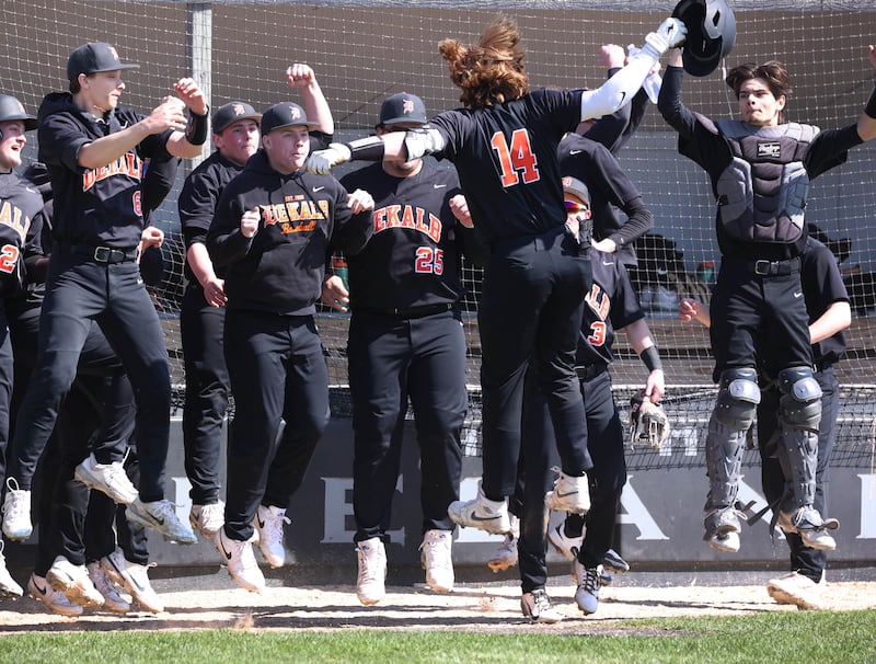 DeKalb's Brodie Farrell (14) celebrates with his team after homering during their game against Kaneland Saturday, April 12, 2025, at Kaneland High School in Maple Park.