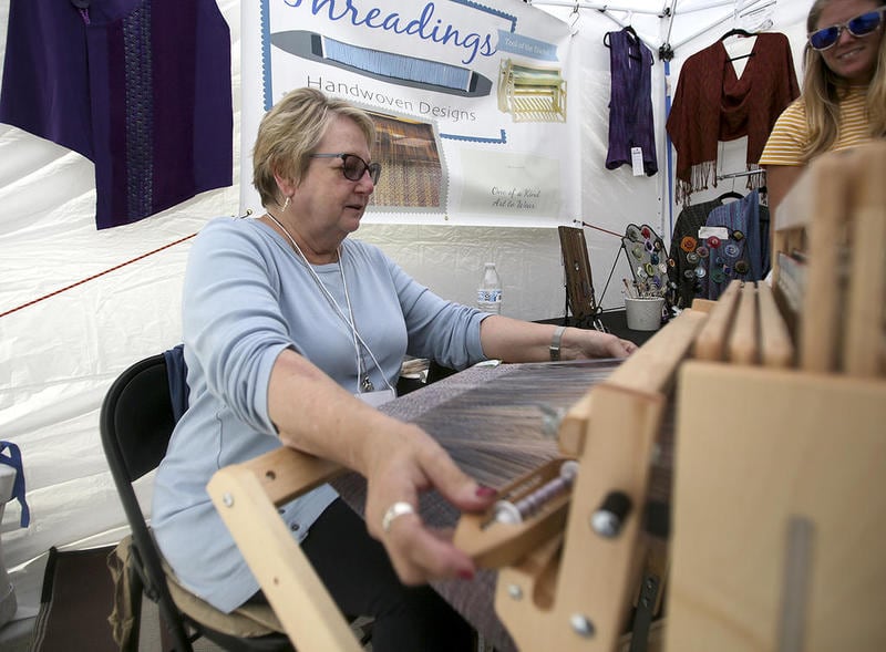 Morris resident Ellen Grenier Bevill, formally of Brookfield, demonstrates handweaving during an Annual Downtown Downers Grove Fine Arts Festival in Downers Grove in this undated photo.