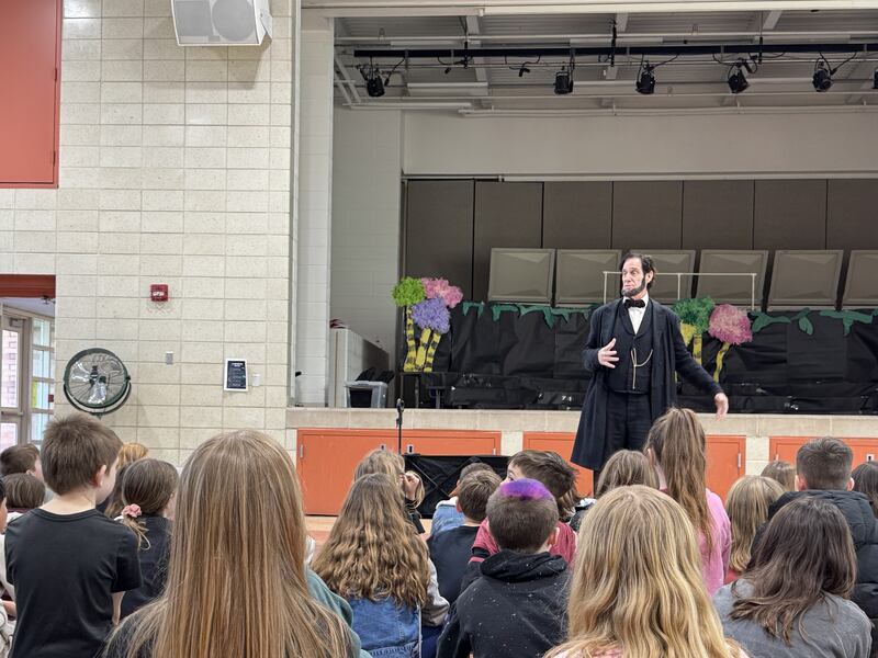 Abraham Lincoln speaks to a group of third-graders at Morris Elementary School on Friday, Feb. 28.