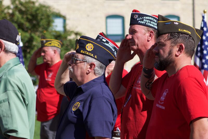 Veteran's salute the flag as it is raised at the Flag Day Monument opening ceremony's at Patriot's Park on Sunday, Oct 1,2023 in Batavia.