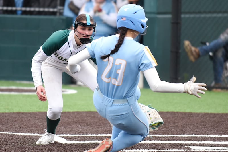 Coal City's Masyn Kuder, left, reaches out to tag Joliet Catholic's Addison Fanter at home plate in the IHSA Class 2A Coal City Regional semifinals Wednesday, May 21, 2025.