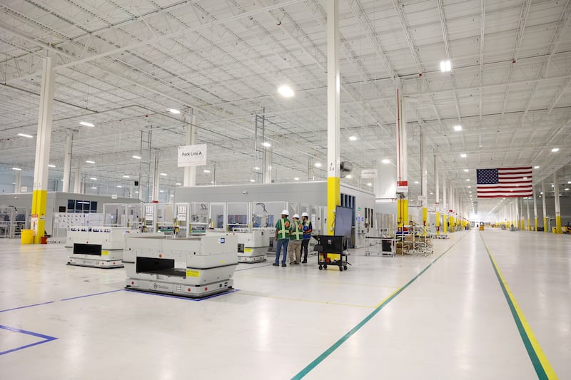Workers tend to Pack Line A at Gotion Illinois in Manteno on Oct. 1, 2025. The battery manufacturing plant has plans to expand its workforce to 450 jobs by the end of 2025, with the goal of reaching 1,400 jobs in 2026.