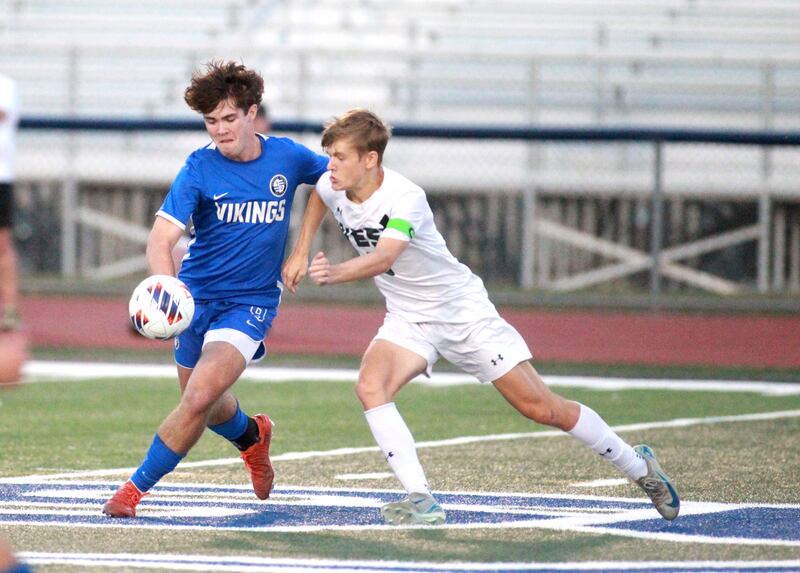 Geneva’s Caleb Kelly (left) and Glenbard West’s Reid Wingerter go after the ball during the Class 3A St. Charles North Sectional semifinal on Tuesday, Oct. 29, 2024 in St. Charles.